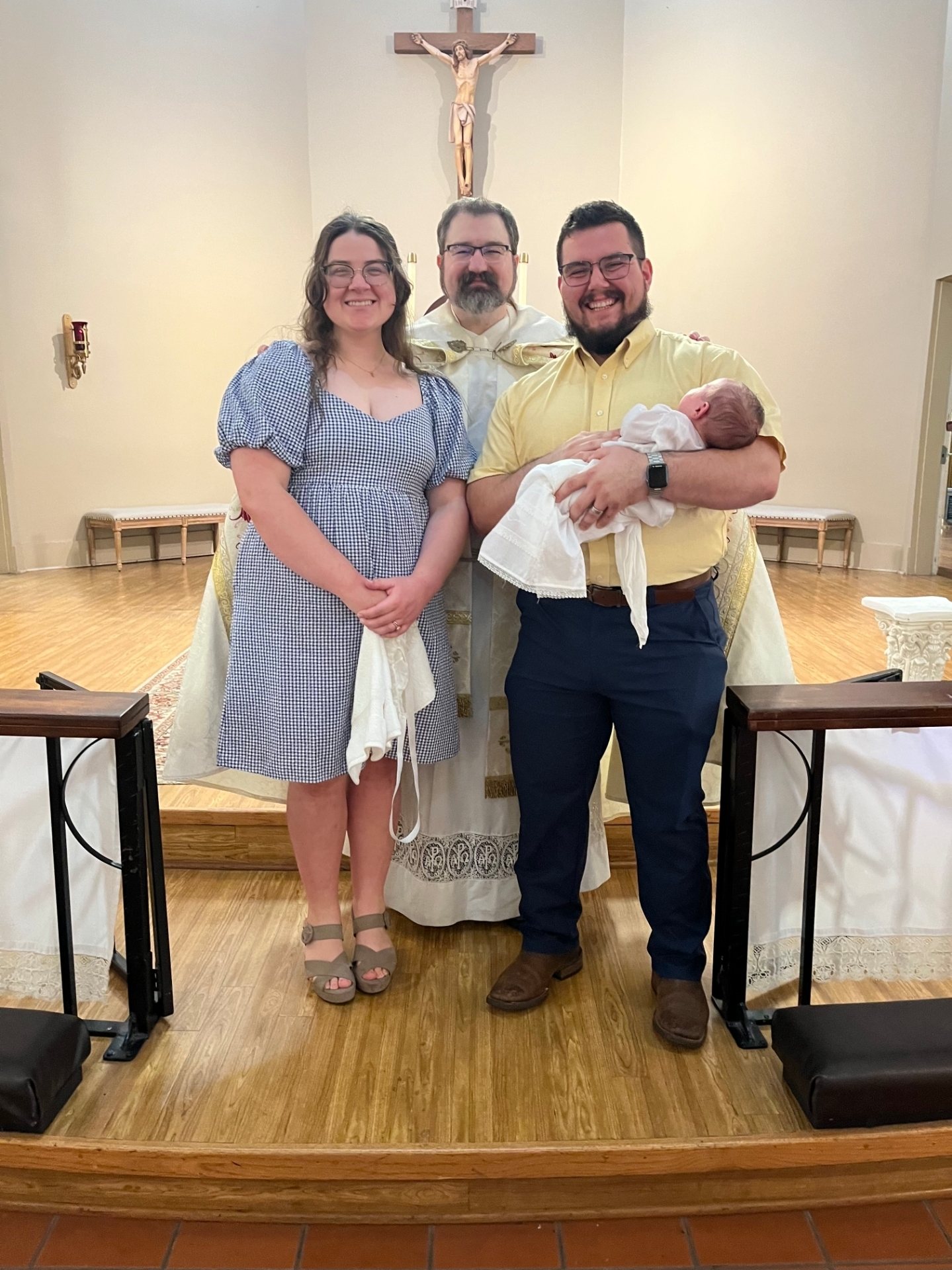 Emily and her husband Jessie with their daughter Ruth at her baptism