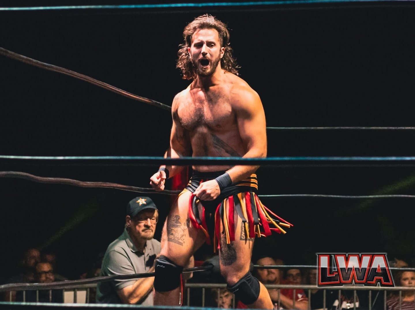 Garret in the ring at an LWA wrestling show, shouting to the crowd