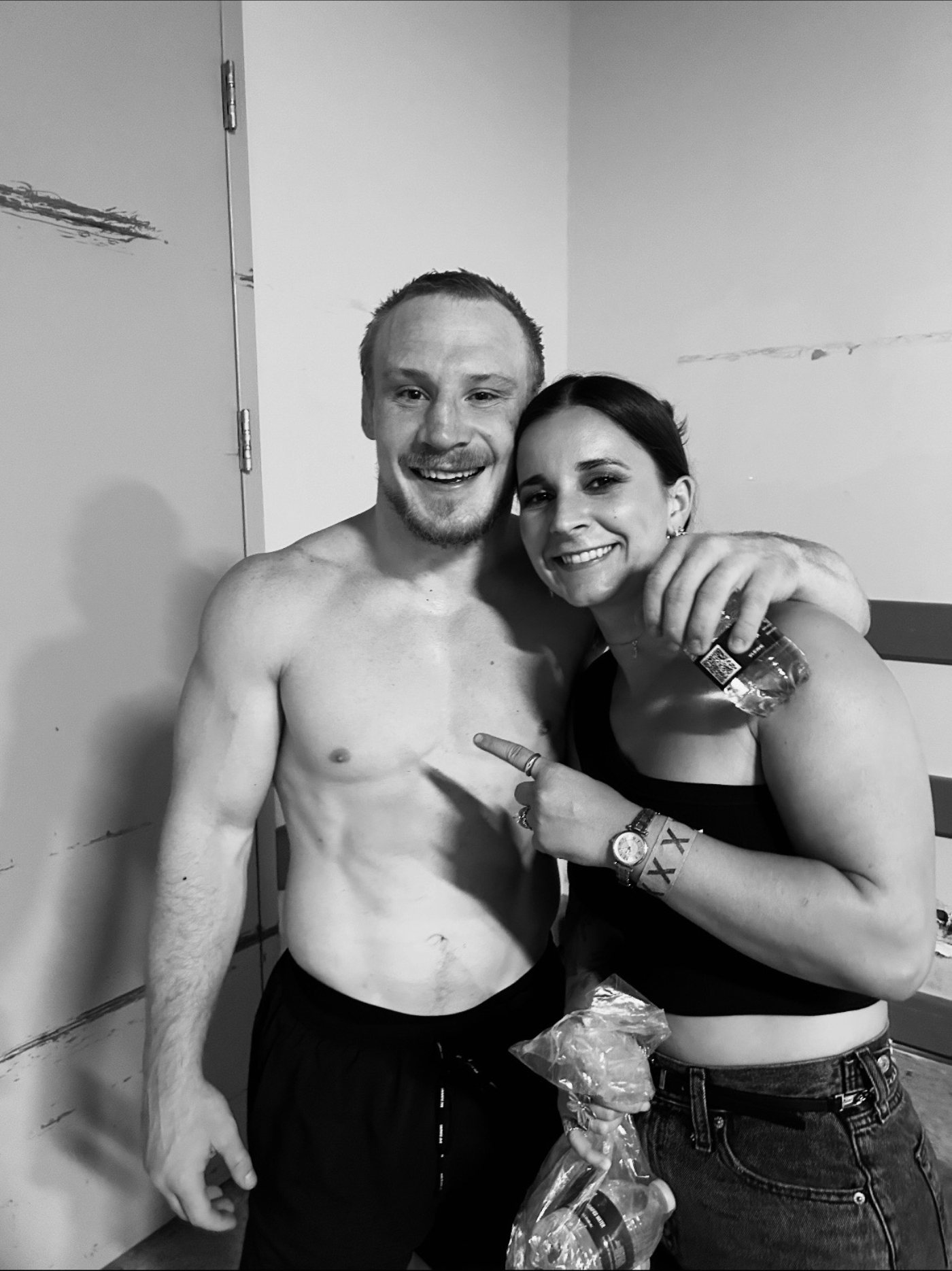 Madison with her husband after one of his fights, black and white