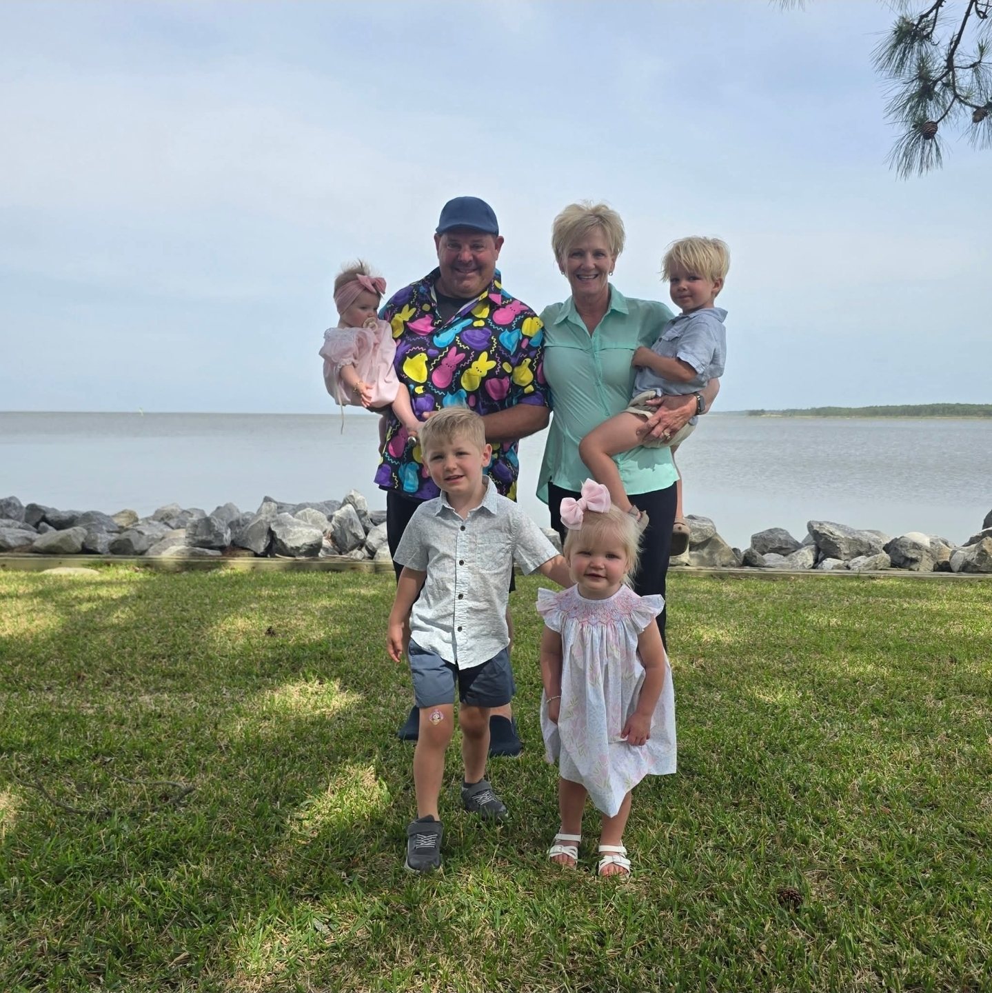 Paul in a Peeps shirt by the water with four little ones in Easter clothes