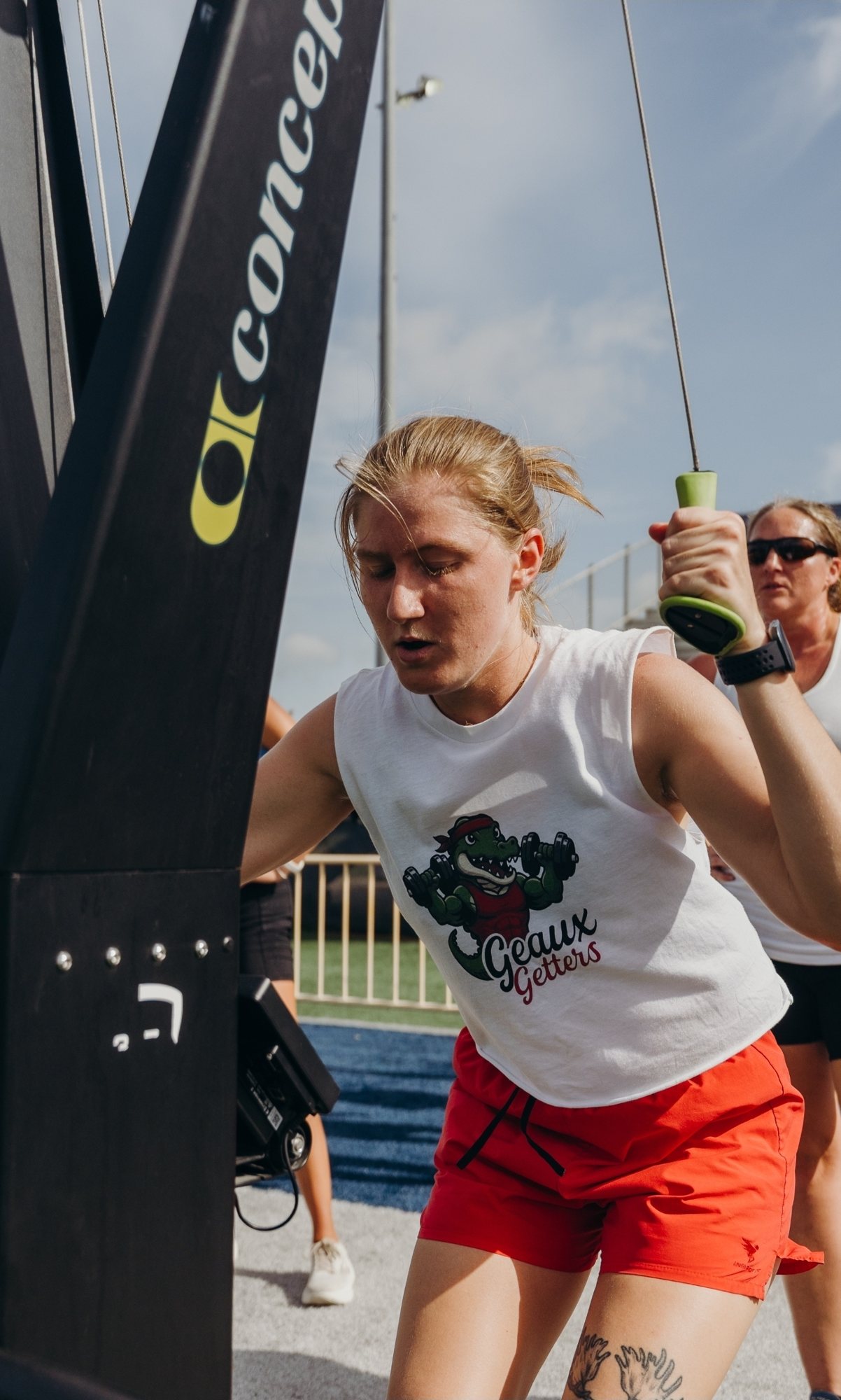 Shannon mid-pull on a ski erg at a Hyrox event