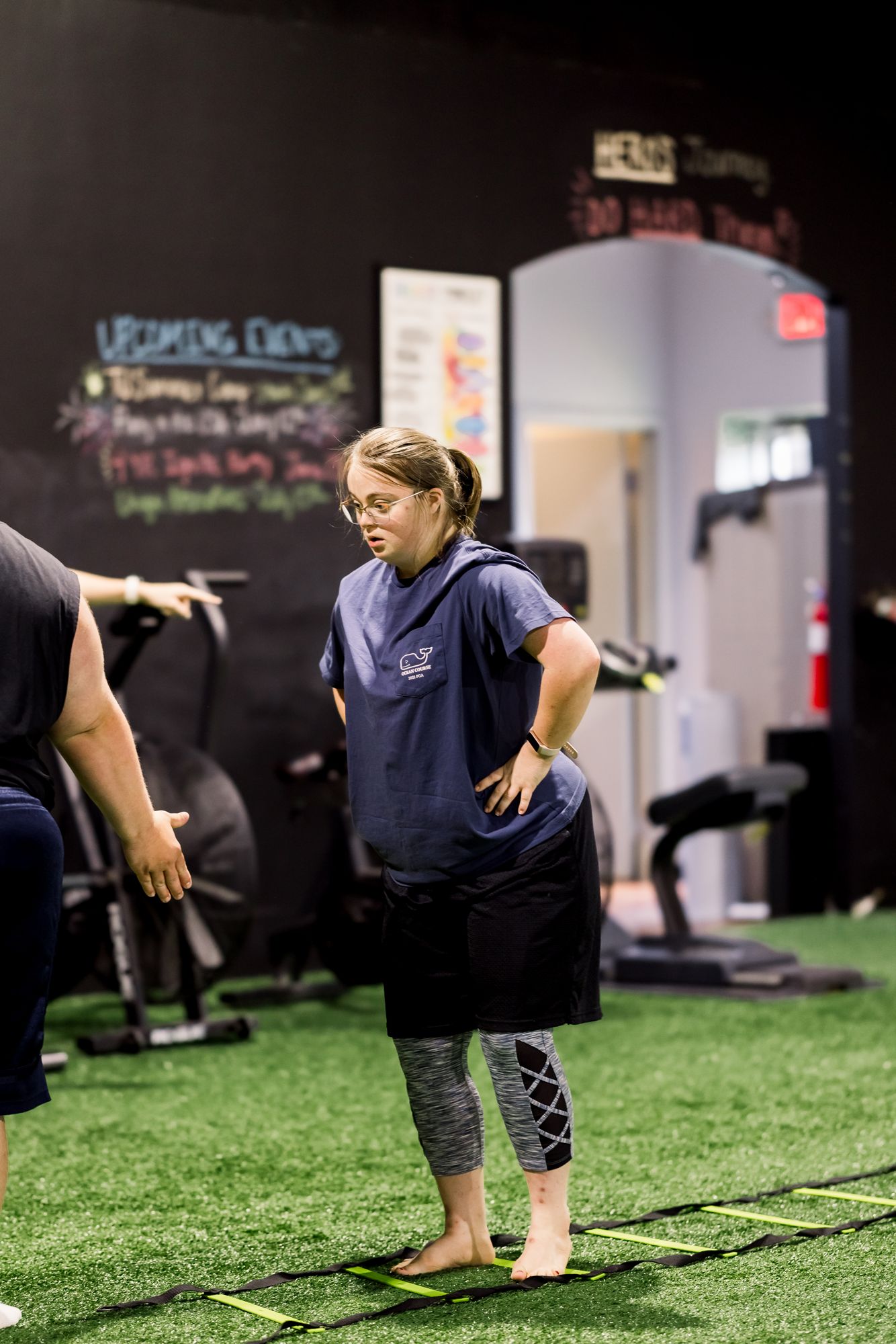An athlete stepping through the agility ladder