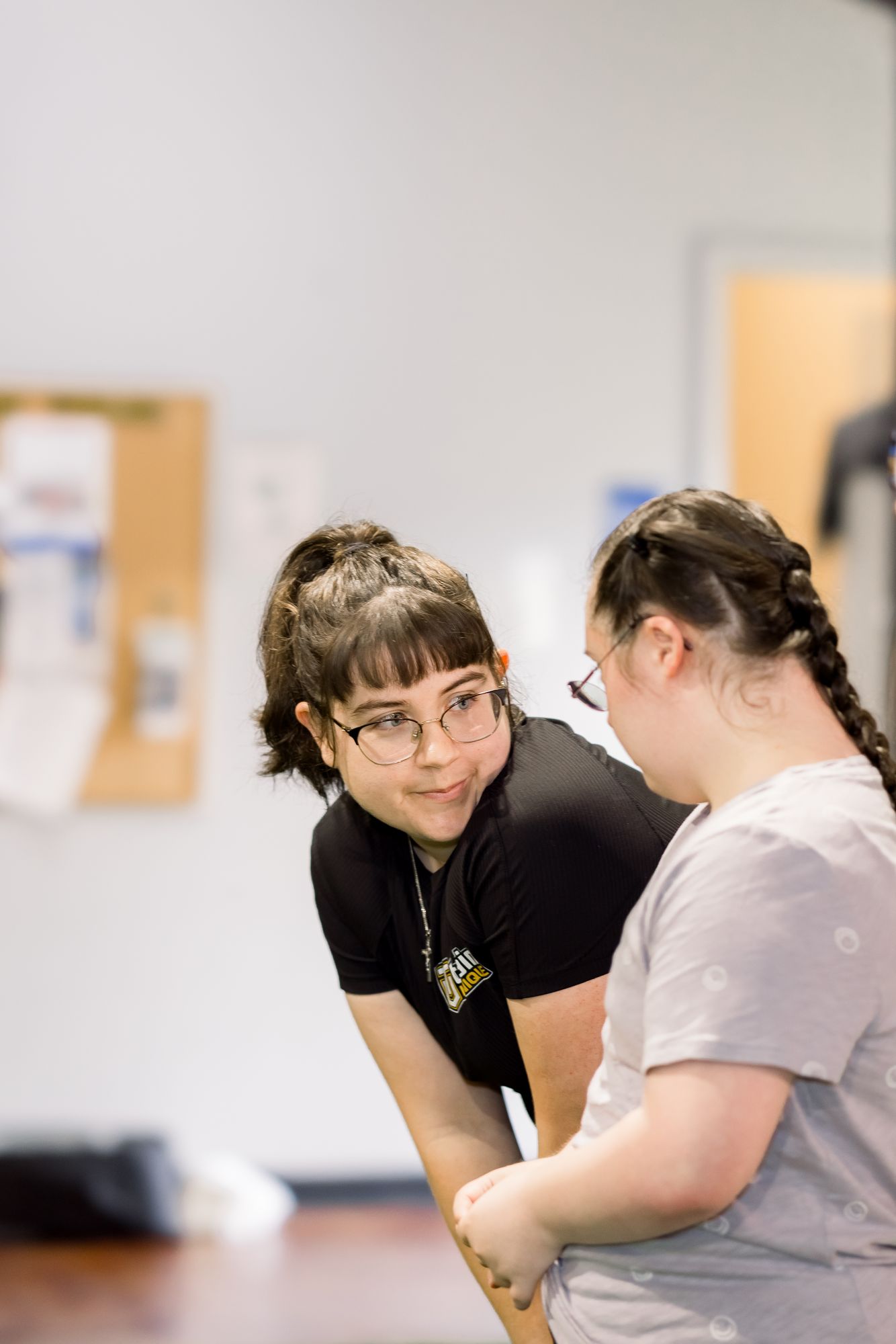 A coach and her athlete face to face