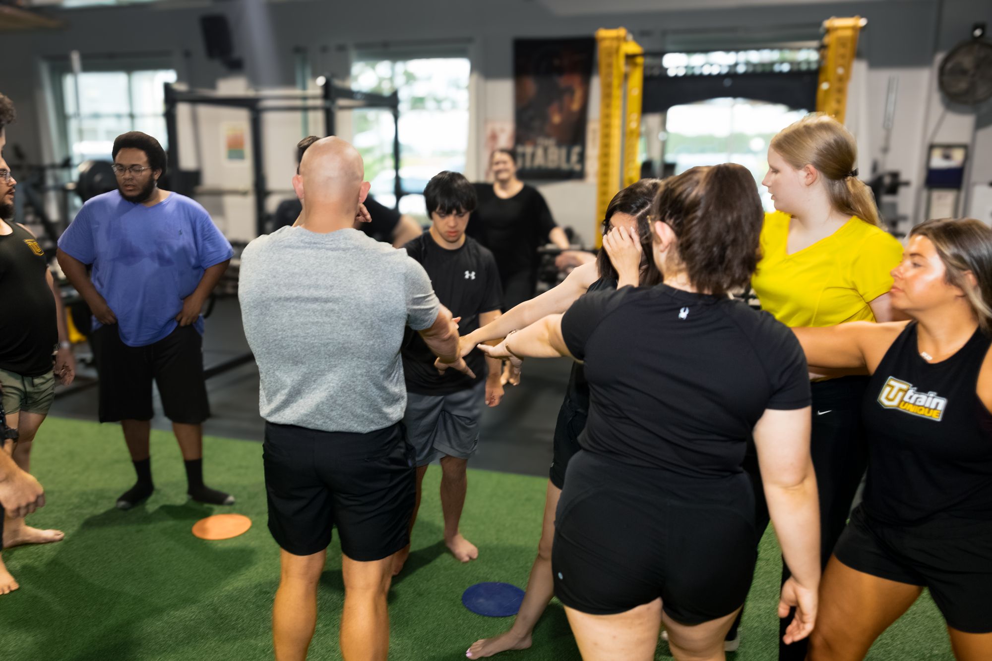 Coaches and athletes gathered mid-class