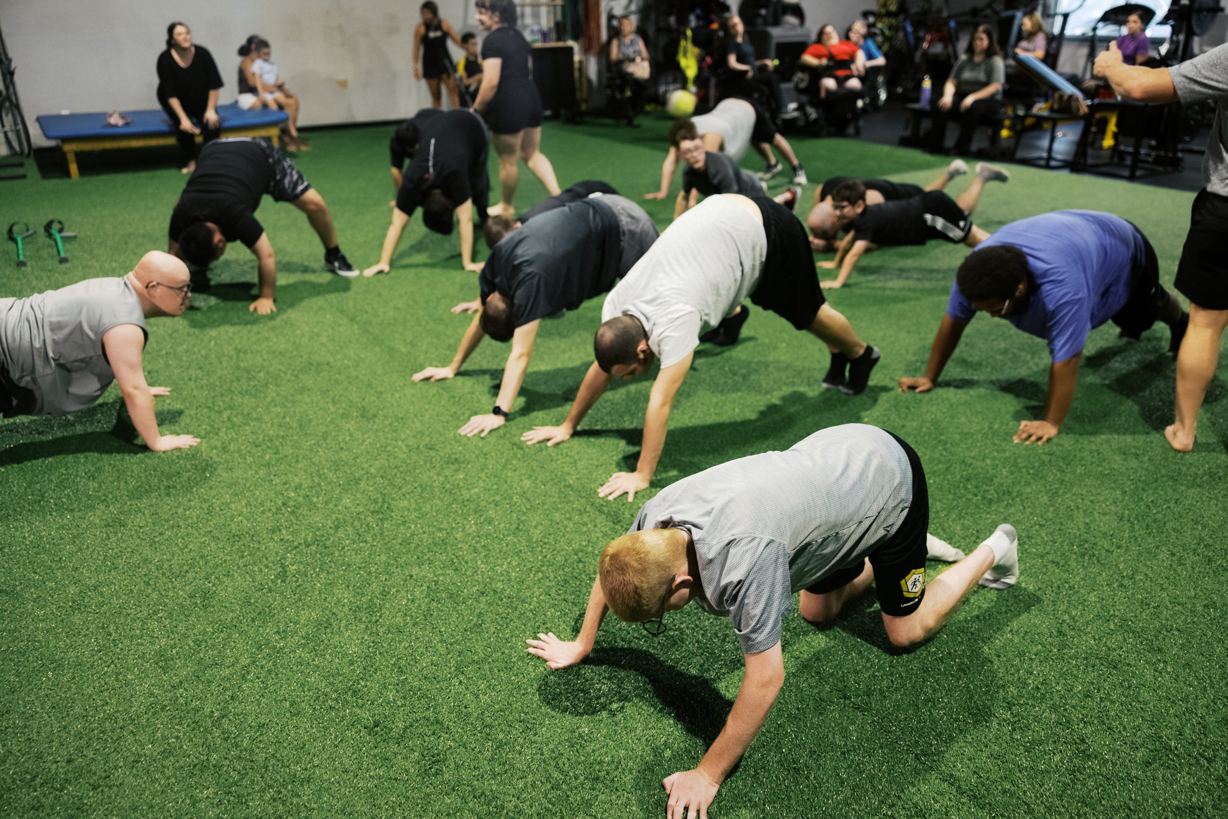 The class working across the turf on all fours