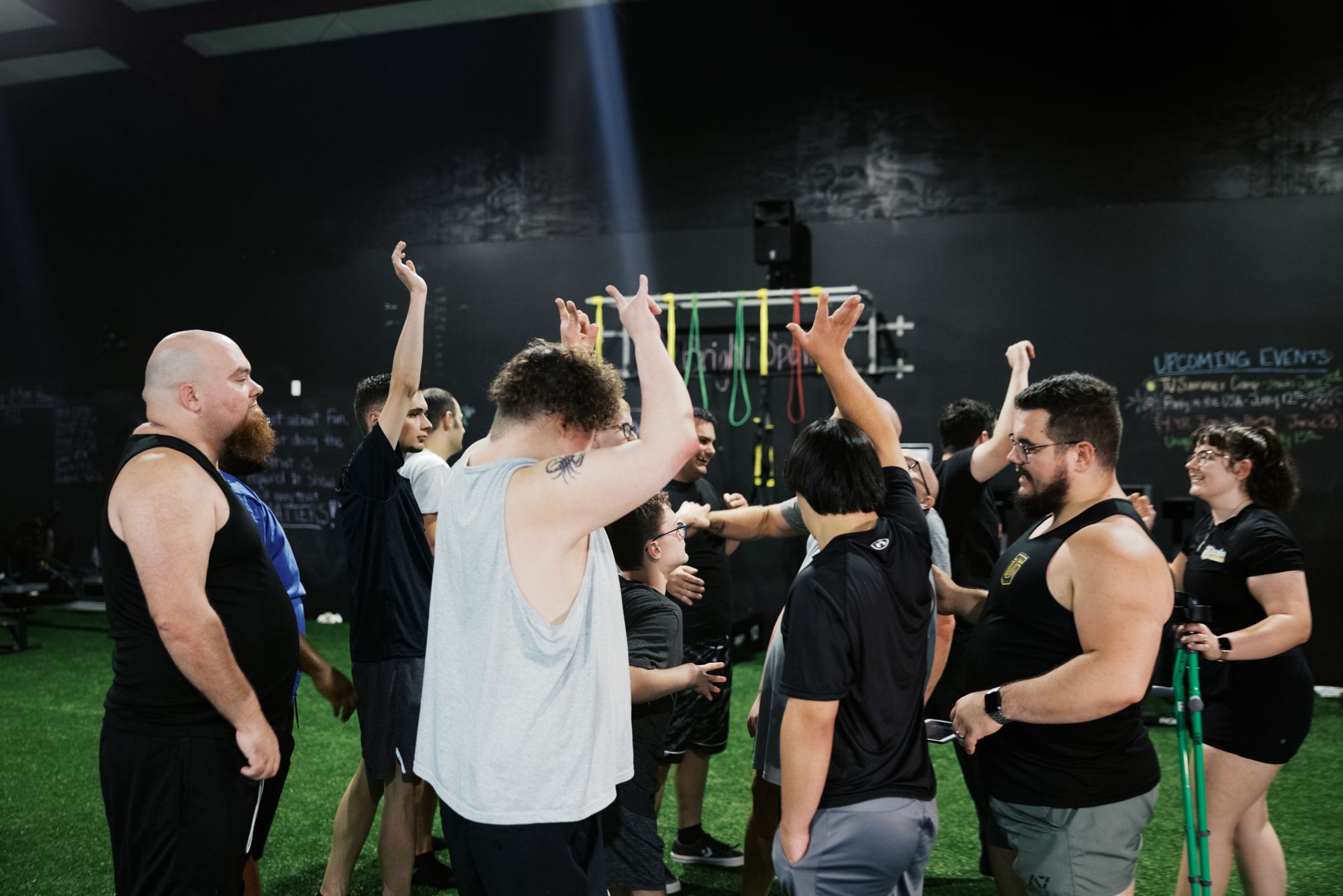 Dumbbells overhead across the group